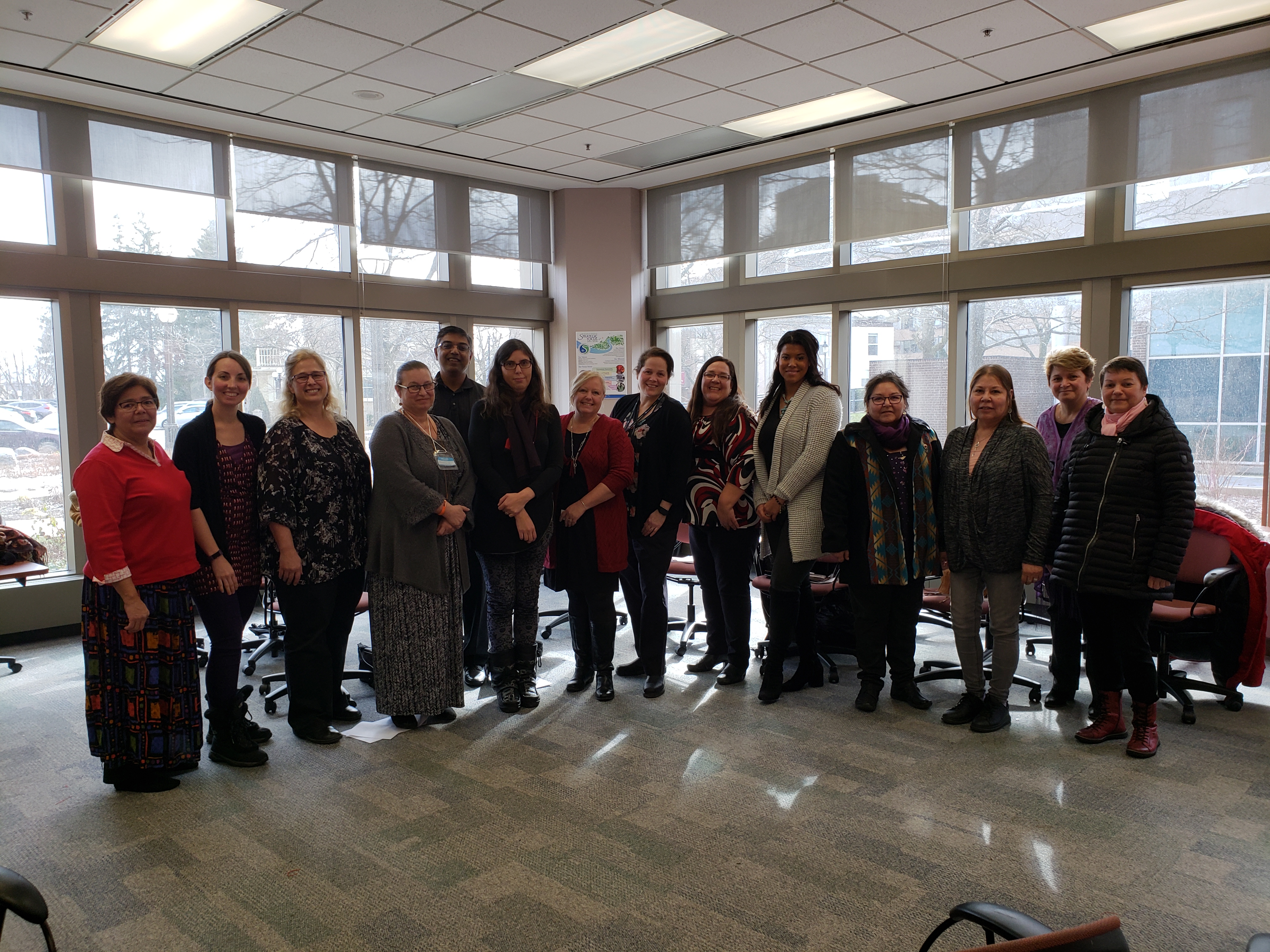 People standing together for a group photo from the First Nations, Inuit, and Metis Advisory and Advocacy Circle