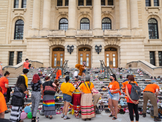 Shoes on the stairs of a residential school to honour the children who died in the Canadian Residential School system