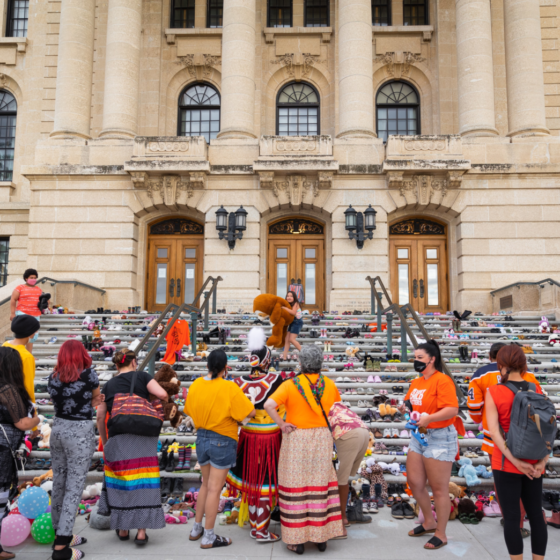 Shoes on the stairs of a residential school to honour the children who died in the Canadian Residential School system