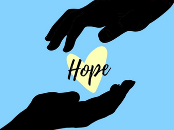 Hands holding a heart that says "Hope"