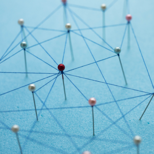 Connected Community Approach Graphic Pins with string creating a systems map